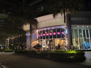 a store front of a building at night at Vortex Suites KLCC by Chia in Kuala Lumpur