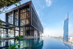 a rendering of a building with a swimming pool at Luxury Suites By Lucentia Residence BBCC Kuala Lumpur in Kuala Lumpur