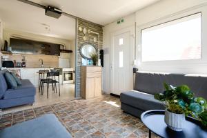 a living room with a couch and a kitchen at pRETTy Home with Private Pool, Sea View in Nea Kallikrateia