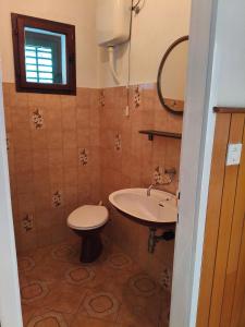 a bathroom with a sink and a toilet at Nice postion, belle vue in Pučišća +21 photos
