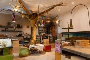 a shop with a tree in the middle of a room at Riad Al Ibtikar in Marrakesh