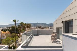 a view from the balcony of a house at Milva Mare Luxury Apartments in Kos