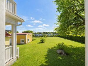 a view of a yard with a house at Spacy flat with big garden in Södertälje