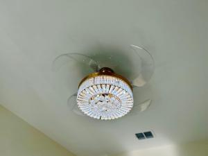 a chandelier is hanging from a ceiling at The Sunshine Studio - No Smoking in Orlando