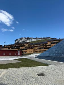 a view of a building with a large solarium at Il rifugio del cuore in San Massimo