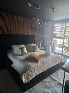 a bedroom with a large bed and a window at chambres d hôtes villa del sole in Puget-sur-Argens +66 photos