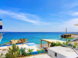 a view of the ocean from the balcony of a resort at Klima Rooms in Palaiochora