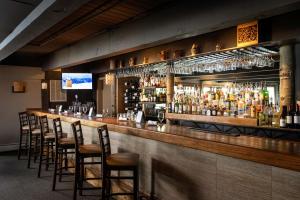 a bar with a bunch of bottles of alcohol at Timberline Condominiums Studio Unit 115 in Snowmass Village +15 photos