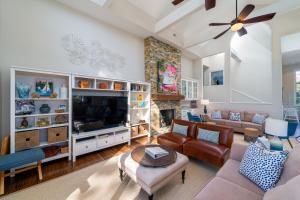 a living room with a tv and a fireplace at 2251 Catesby's Bluff in Seabrook Island