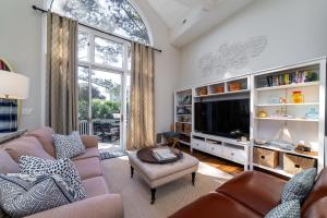 a living room with two couches and a tv at 2251 Catesby's Bluff in Seabrook Island +38 photos