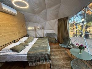 a bedroom with a bed in a tent at Trichk Resort in Goris