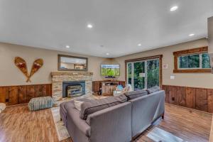 a living room with a couch and a fireplace at 3BD with Hot Tub Two Minutes from King Beach in Tahoe Vista