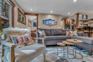a living room with a couch and a table at 3BD with Hot Tub Two Minutes from King Beach in Tahoe Vista