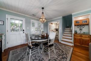 a dining room with a table and chairs at 546 Tarpon Pond Cottage in Seabrook Island +33 photos