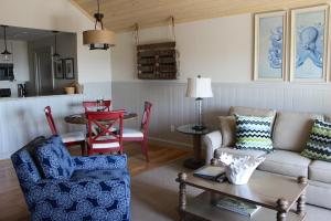 a living room with a couch and a table at 13106 Pelican Watch Villa in Seabrook Island