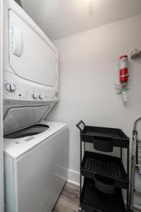 a kitchen with a microwave and a washer and dryer at 1306 Pelican Watch Villa in Seabrook Island +17 photos