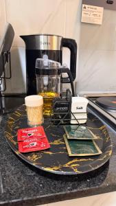 a counter top with a plate with a blender on it at Pinnacle Homes 254 - Ruaka in Ruaka