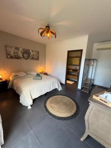 a bedroom with a bed and a ceiling fan at Casa Avvena 1 in Lecci