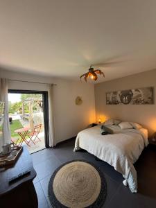a bedroom with a bed and a large window at Casa Avvena 1 in Lecci