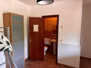 a bathroom with a toilet and a sink at Camping Riba-roja in Riba-roja d'Ebre +45 photos