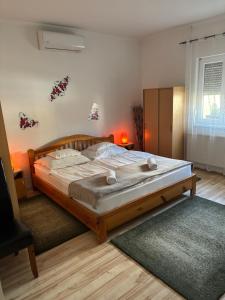 a bedroom with a large bed in a room at A-BB-LAK in Hajdúszoboszló