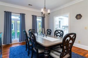 a dining room with a table and chairs at 2873 Hidden Oak Drive in Seabrook Island