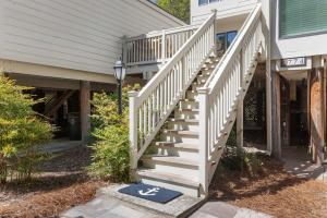 a white staircase in front of a house at 774 Spinnaker Beach House in Seabrook Island