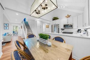 a kitchen and dining room with a table and chairs at 903 Sealoft Villa in Seabrook Island +24 photos
