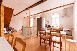 a kitchen and dining room with a table and chairs at Casa Bubela - Vía de la plata in Dozón