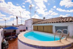 a swimming pool on the roof of a house at La Casa de Claudio Marcelo in Córdoba