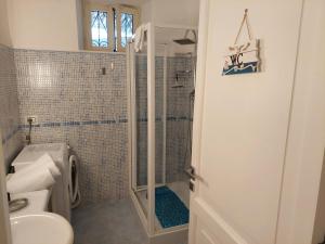 a bathroom with a shower and a toilet and a sink at Sea suite positano in Positano +43 photos