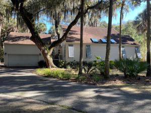 a white house with trees in front of it at 2713 Seabrook Island Road in Seabrook Island