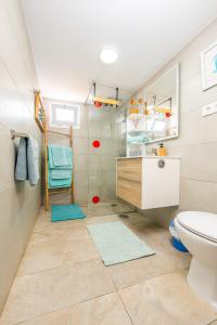 a bathroom with a sink and a toilet at Vista Paraiso, Sea breeze facing the sea in La Oliva +23 photos