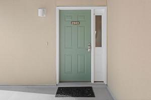 a green door with the number twentyeight on it at 2943 Atrium Villa in Seabrook Island