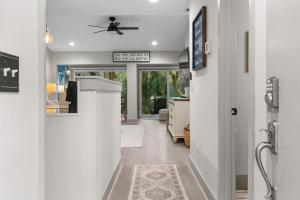 a hallway of a home with a ceiling fan at 620 Shadowwood in Seabrook Island +31 photos