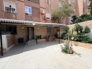 an outside view of a building with a courtyard at Escapade urbaine moderne in Sétif