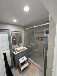 a bathroom with a shower and a sink and a toilet at Escapade urbaine moderne in Sétif +9 photos