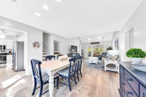 a kitchen and living room with a table and chairs at 507 Tarpon Pond Cottage in Johns Island +40 photos