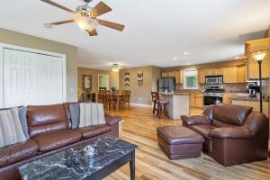a living room with a couch and a table at Cozy Corner in Oswego +23 photos