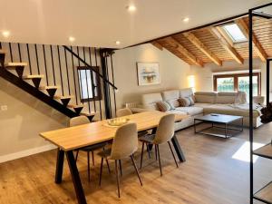 a living room with a table and a couch at Kantauri Homes- KAI in Bermeo