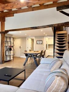 a living room with a couch and a table at Kantauri Homes- KAI in Bermeo