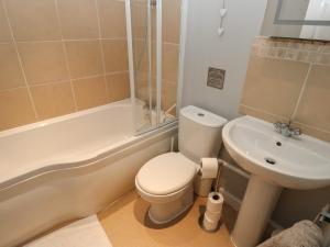 a bathroom with a toilet and a sink at Riverview Cottage in Holmfirth +27 photos