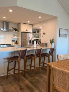 a kitchen with a table and chairs in a kitchen at 1338 Pelican Watch Villa in Seabrook Island