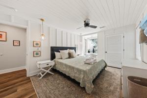 a bedroom with a bed and a ceiling fan at 1338 Pelican Watch Villa in Seabrook Island +42 photos