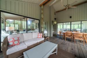 a living room with a couch and a dining room at 2264 Seascape Crt. in Seabrook Island +42 photos