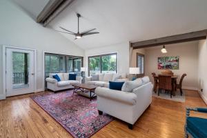 a living room with two couches and a table at 2264 Seascape Crt. in Seabrook Island