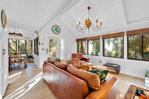 a living room with a couch and a table at 804 Treeloft Cottage in Seabrook Island