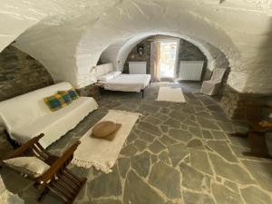 a living room with a couch and a table at La Antica Torre in Sasseta