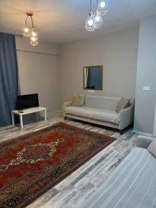 a living room with a bed and a couch at Adrasan village house in Kumluca
