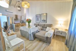 a living room with a couch and a table at Apartamentos La Gruta de Aracena 3 in Aracena